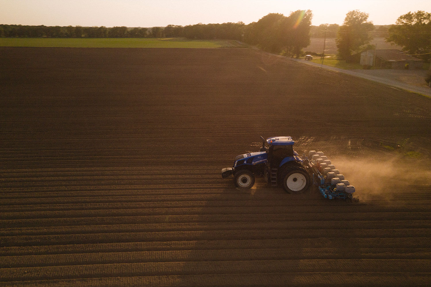 Two farmers taking care of the fields.